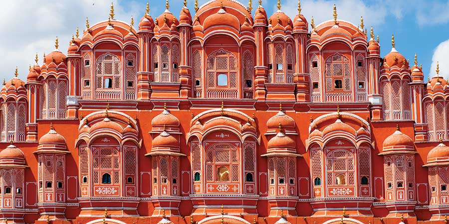 The Palace of the Winds in Jaipur is iconic for its bright coral pink colour and beautiful architectural features.